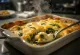 Bacalhau com natas y espinacas, platillo de pescado con salsa cremosa