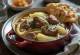 Fårikål con carne de cordero y col, servido con pan plano