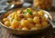 Chana Dal Halwa con ricos sabores especiados, nueces tostadas y agua de rosas.