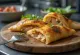 Calzone de pechuga de pollo a la parrilla dorado al horno