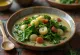 Caldo verde con col rizada, servido con chorizo